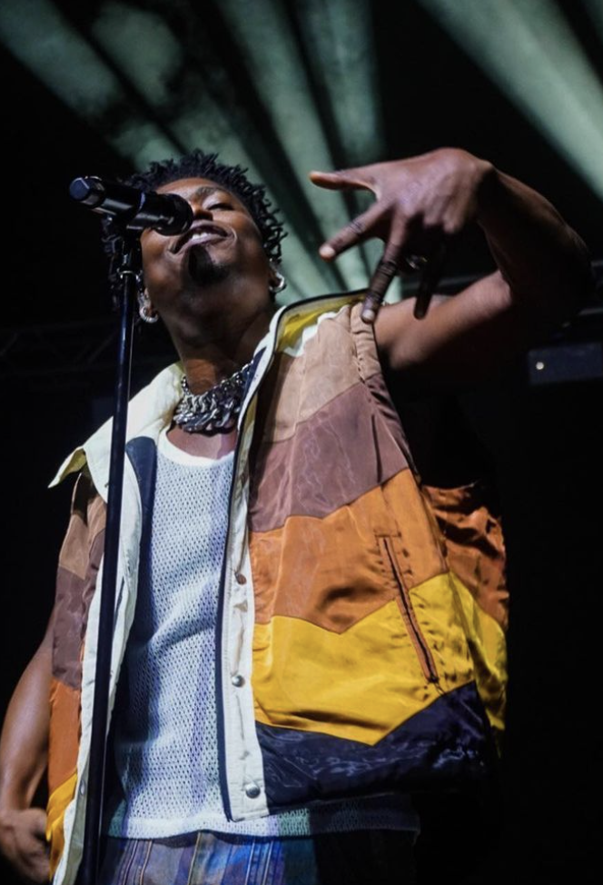 Photo of Lucky Daye performing at the homecoming concert